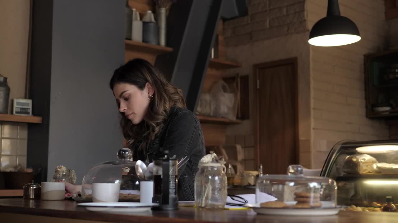 Stock Video A Woman Reading A Book At A Coffee Shop Live Wallpaper For PC