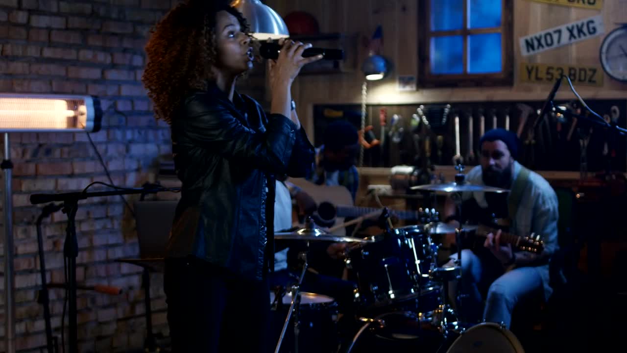 Stock Video A Woman Practicing With Band In The Garage Live Wallpaper For PC