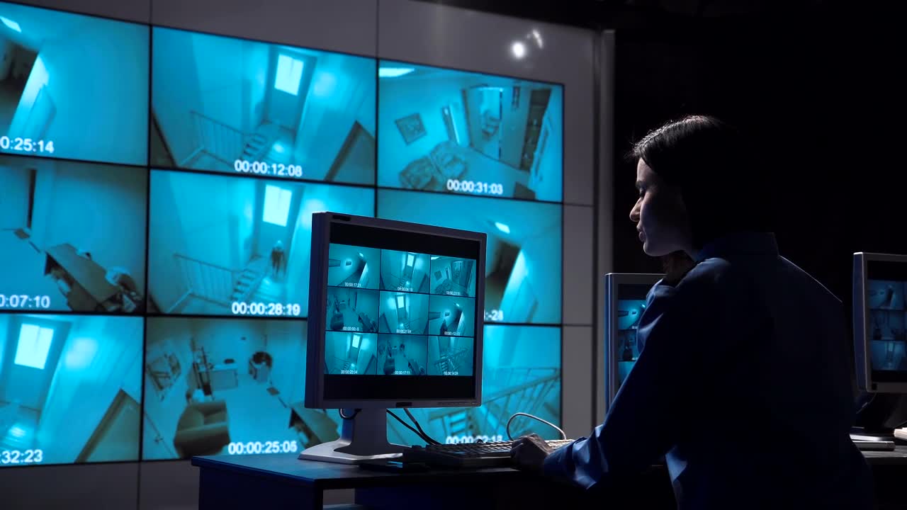 Stock Video A Woman Monitoring Close Circuit Surveillance Live Wallpaper For PC