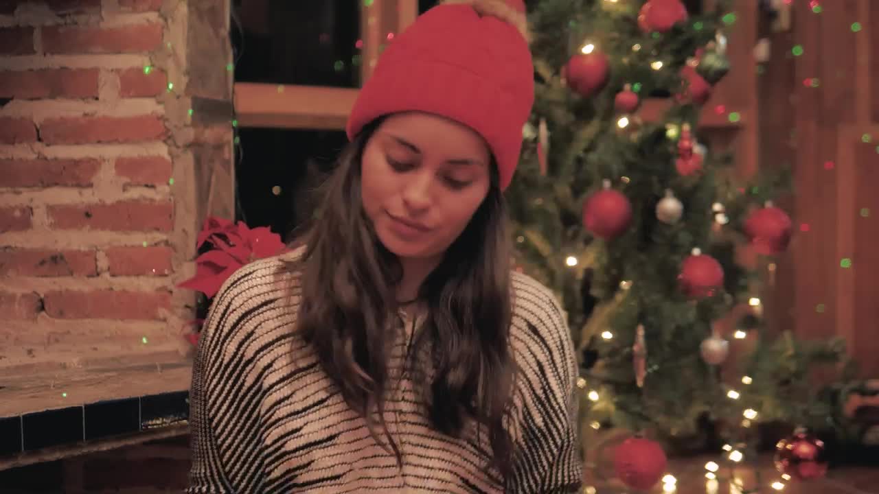 Stock Video A Woman Chooses Ornaments For Her Christmas Tree Live Wallpaper For PC