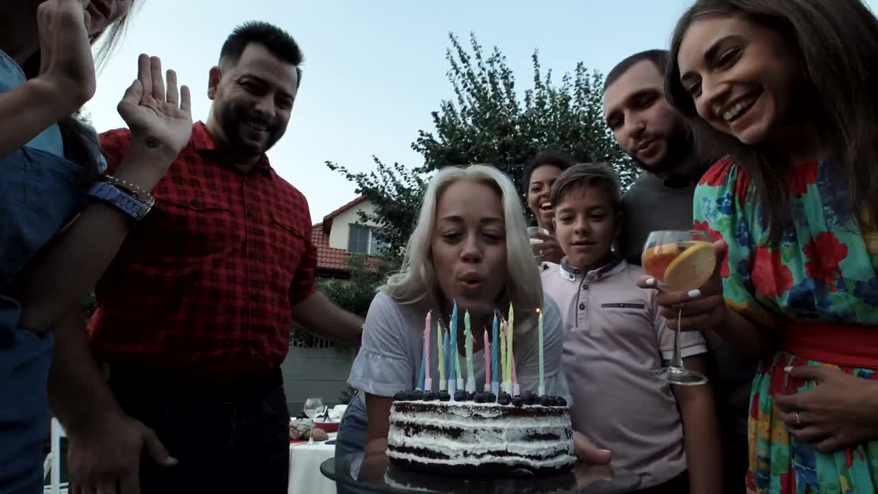 Stock Video A Woman Blows The Candles In A Birthday Party Live Wallpaper For PC