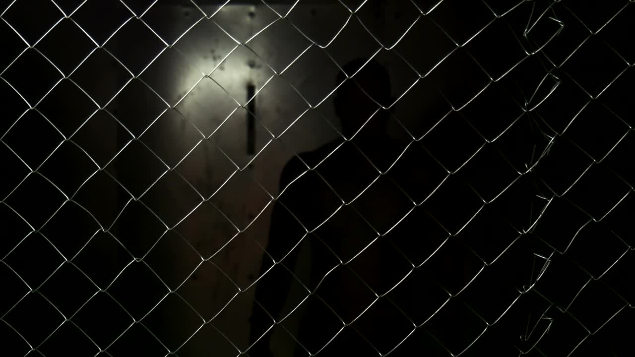 Stock Video A Shirtless Man Behind A Wire Fence Live Wallpaper For PC