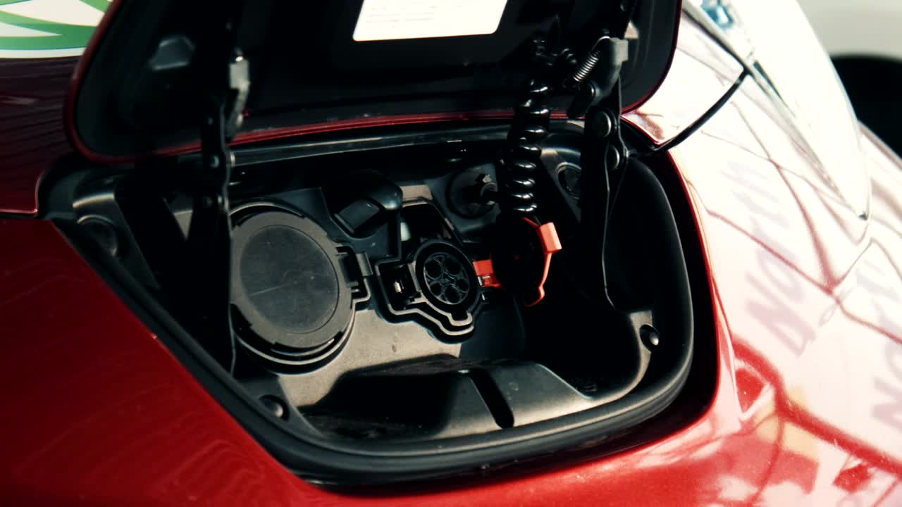 Stock Video A Red Electric Car Being Charged Live Wallpaper For PC
