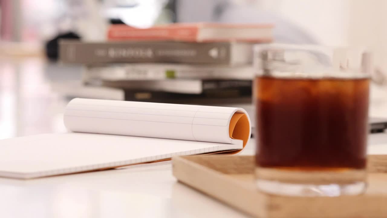 Stock Video A Person Writing On A Notebook At A Coffee Shop Live Wallpaper For PC