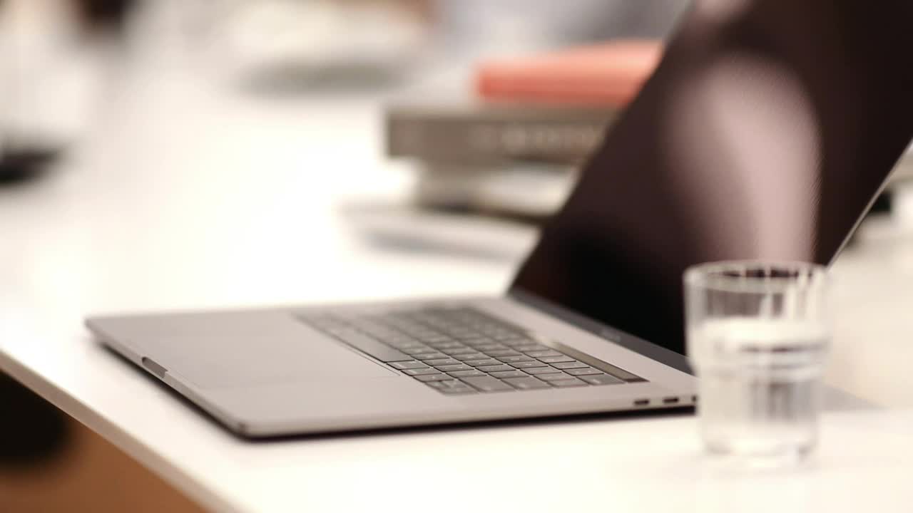 Stock Video A Person Typing In A Laptop At A Coffee Shop Live Wallpaper For PC