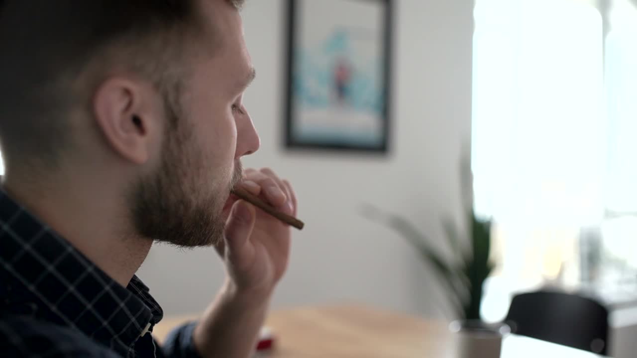 Stock Video A Person Smoking A Cigarette Indoors Live Wallpaper For PC