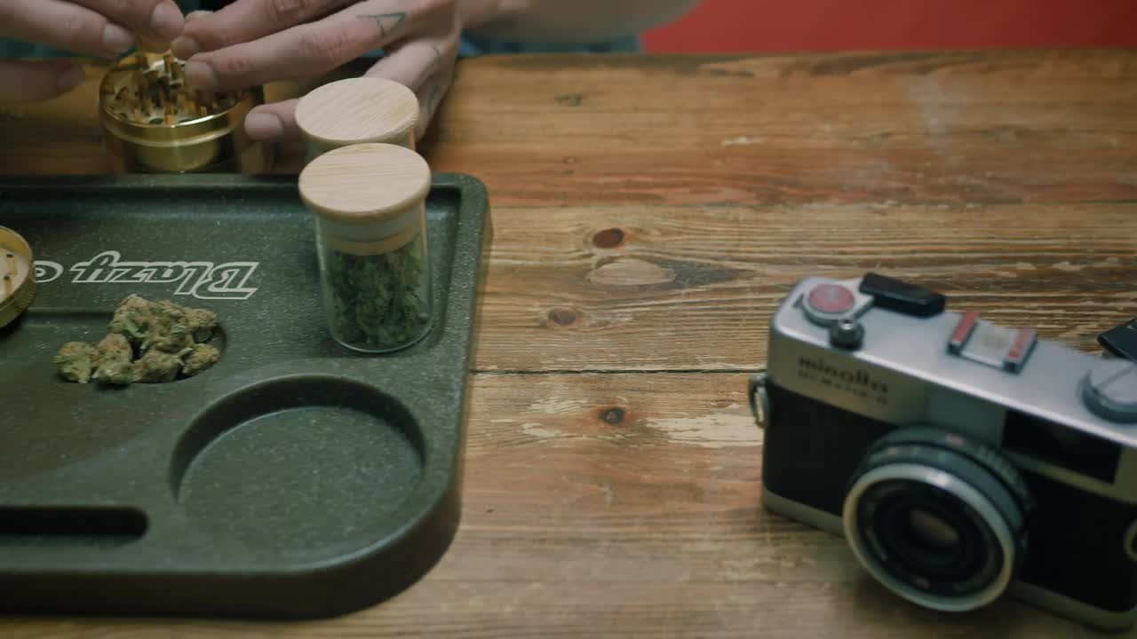 Stock Video A Person Preparing A Marijuana Cigar Live Wallpaper For PC