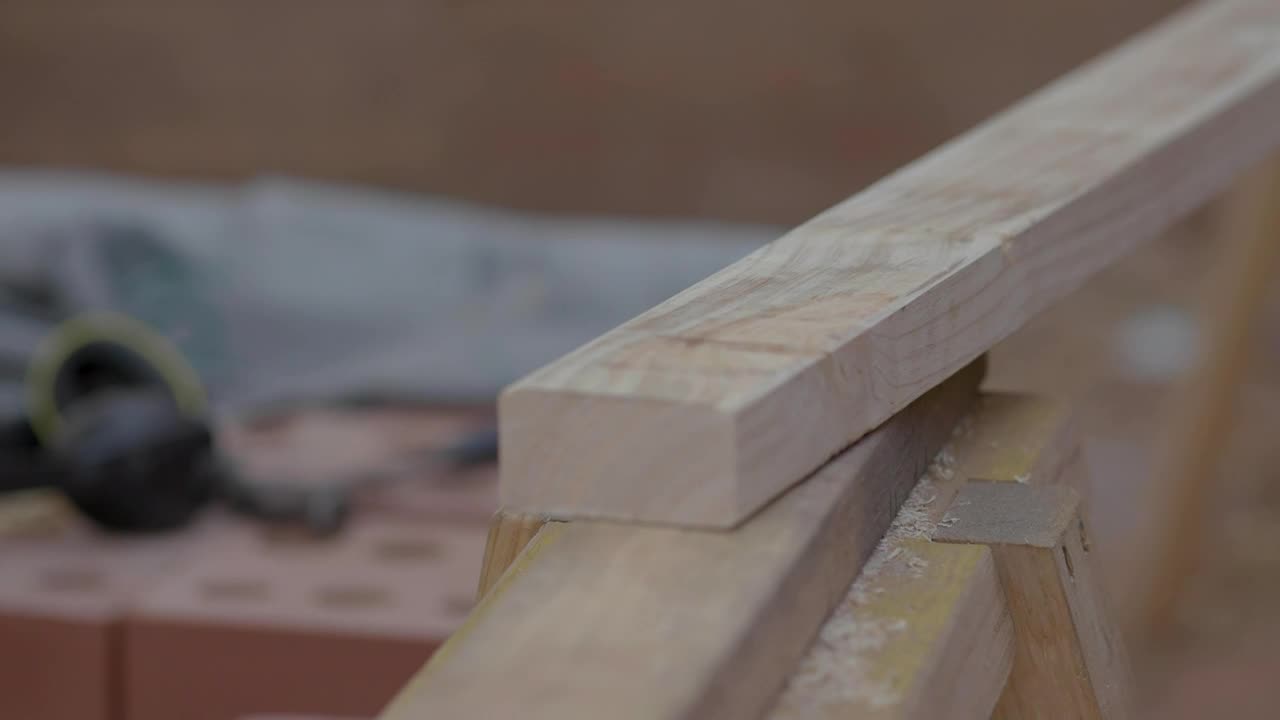 Stock Video A Person Measures A Block Of Wood For Construction Live Wallpaper For PC