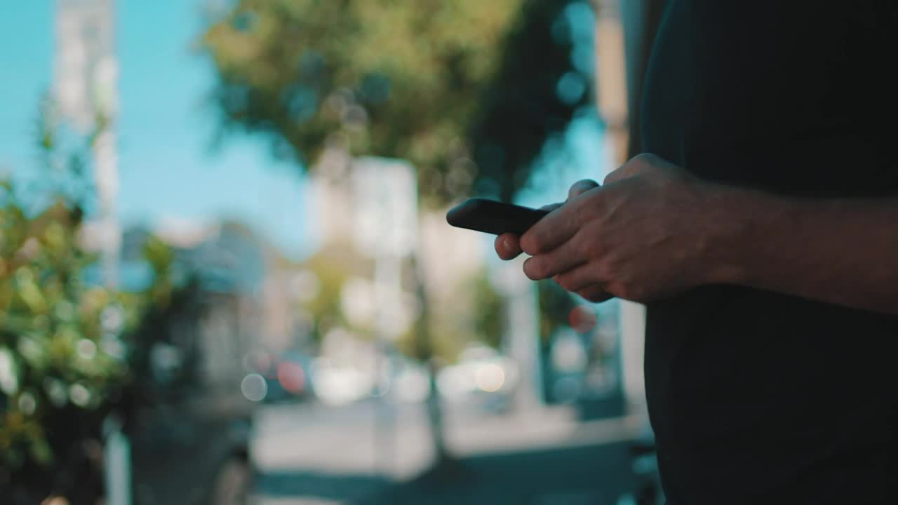 Stock Video A Person In The Street Messaging On A Smartphone Live Wallpaper For PC