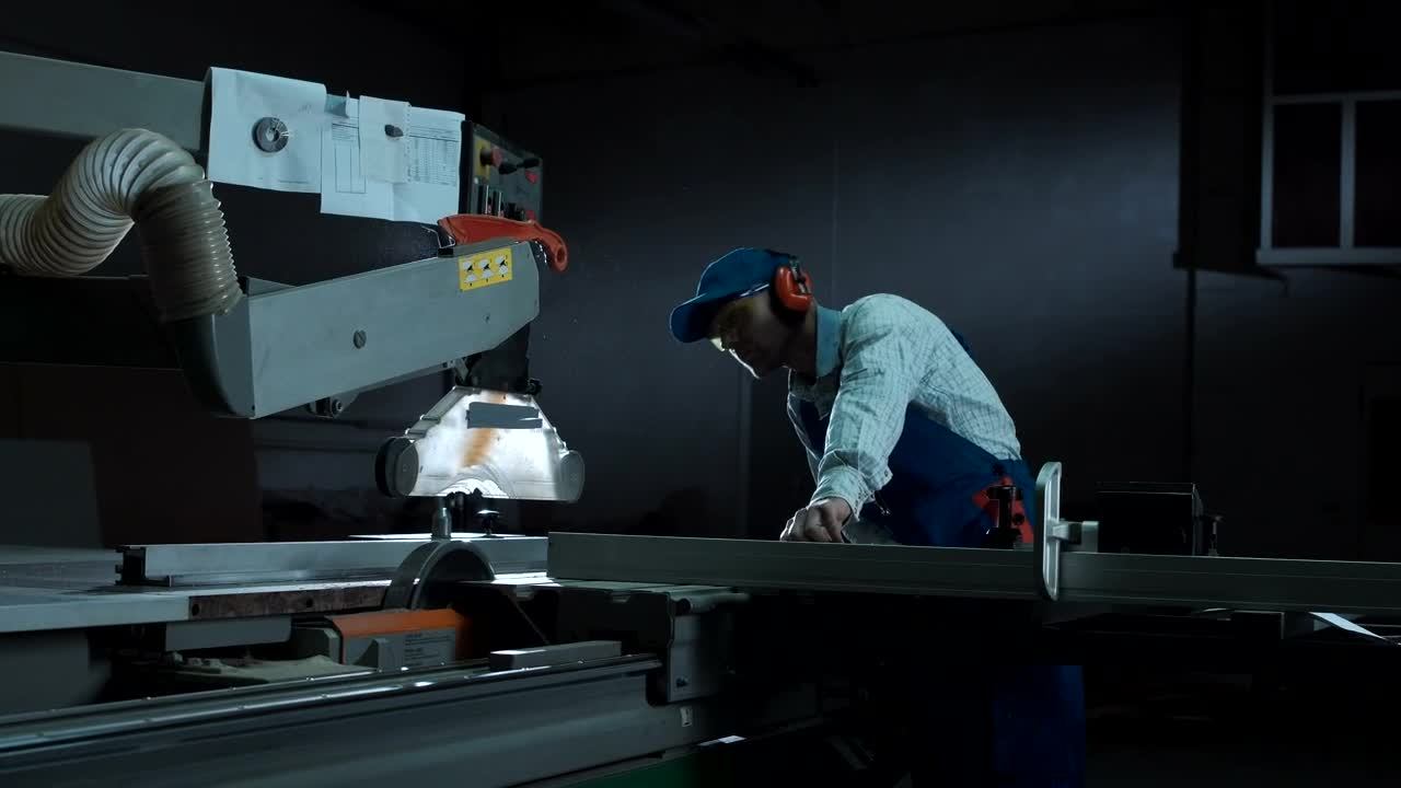 Stock Video A Man Working With A Saw In The Workshop Live Wallpaper For PC
