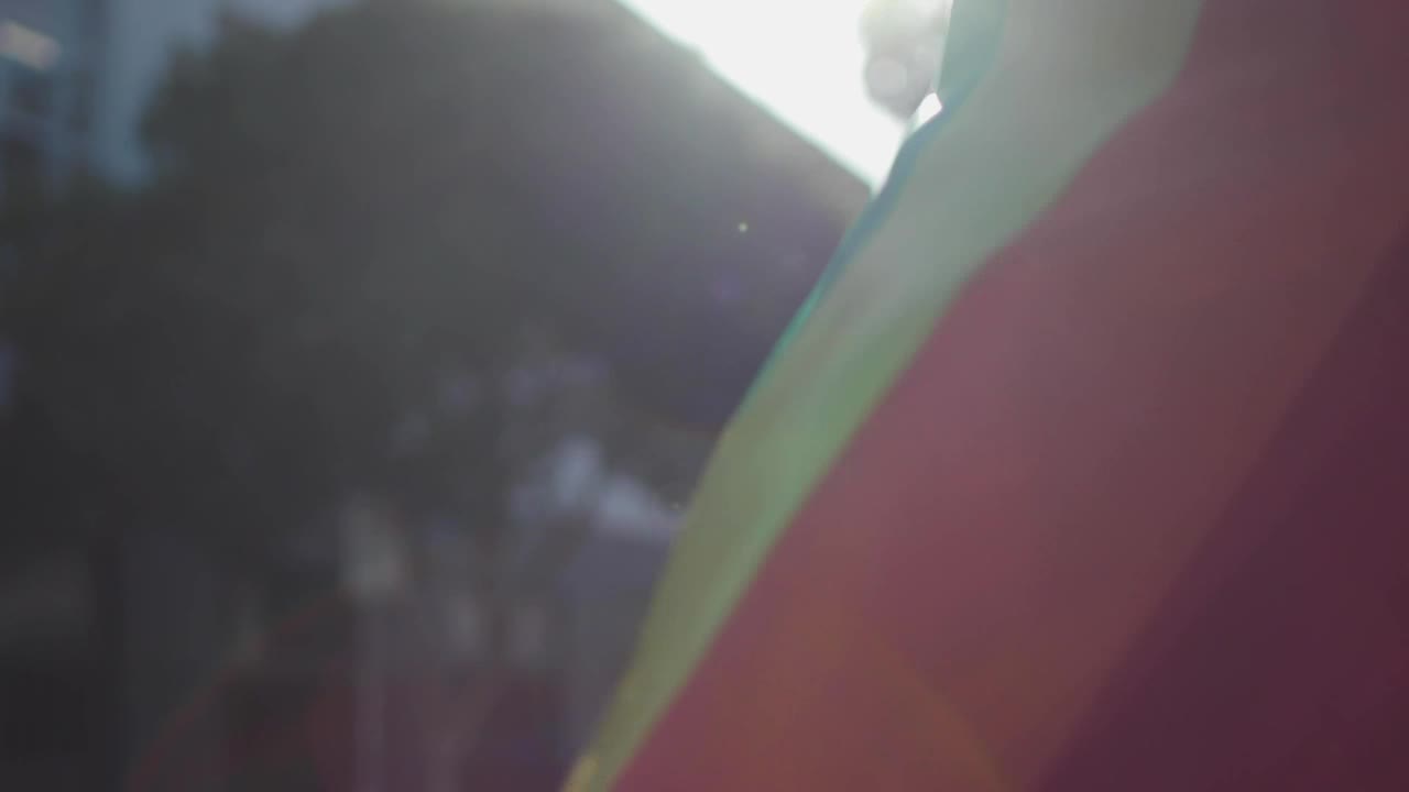 Stock Video A Man Wearing A Rainbow Flag As A Cape Live Wallpaper For PC