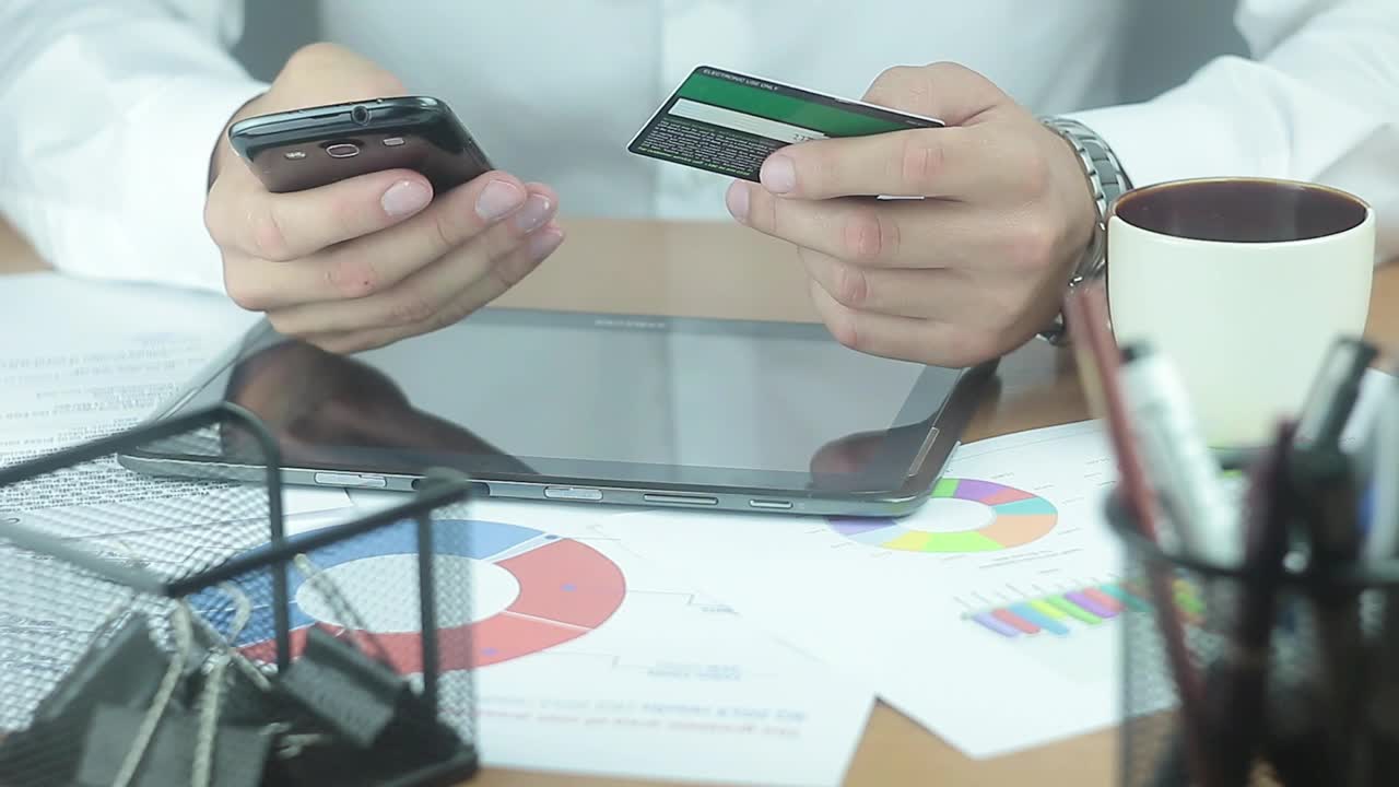 Stock Video A Man Texting On The Phone While Holding A Credit Live Wallpaper For PC