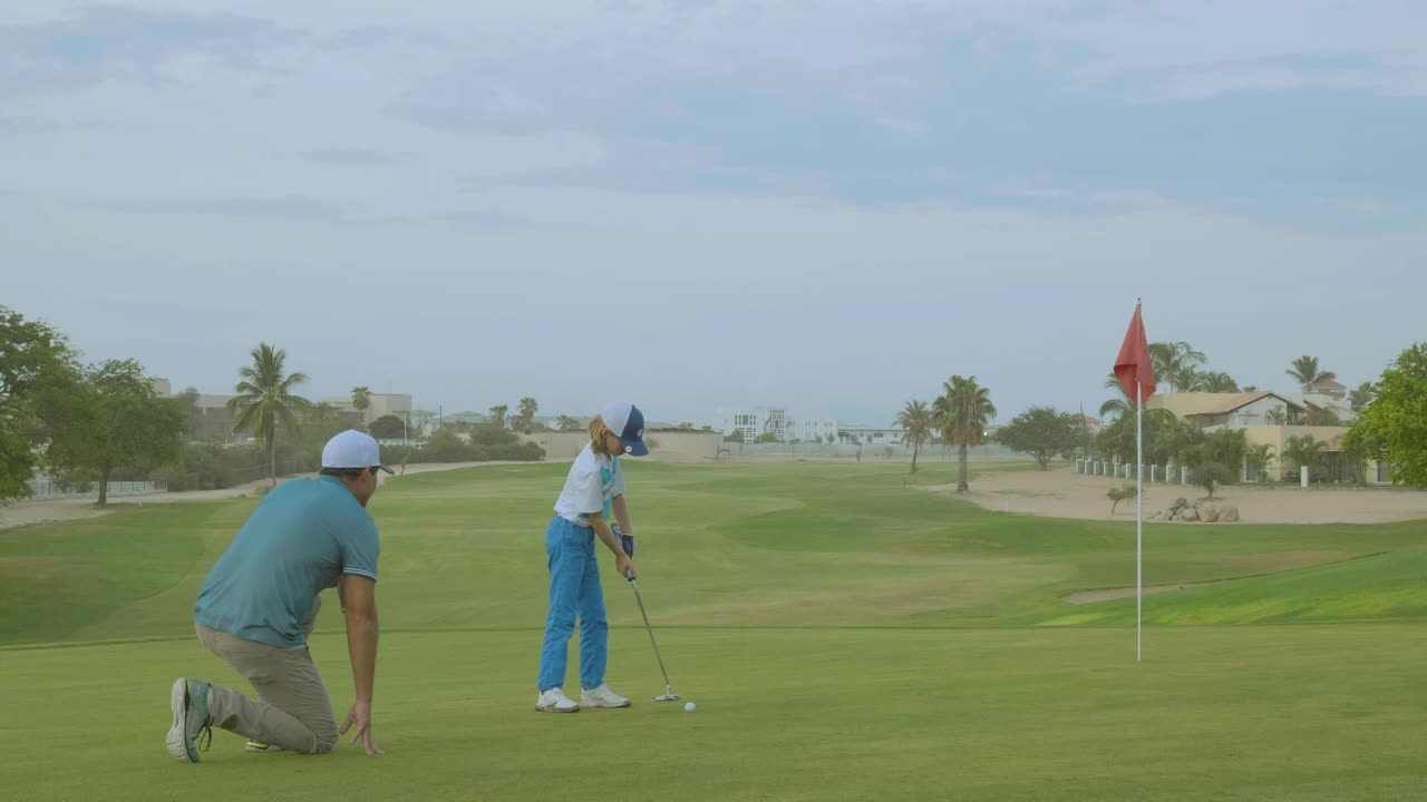 Stock Video A Man Teaching His Son How To Play Golf Live Wallpaper For PC