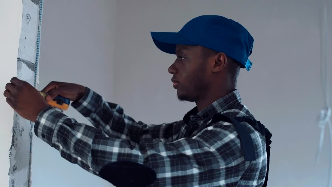 Stock Video A Man Taking Measurements On Construction Site Live Wallpaper For PC