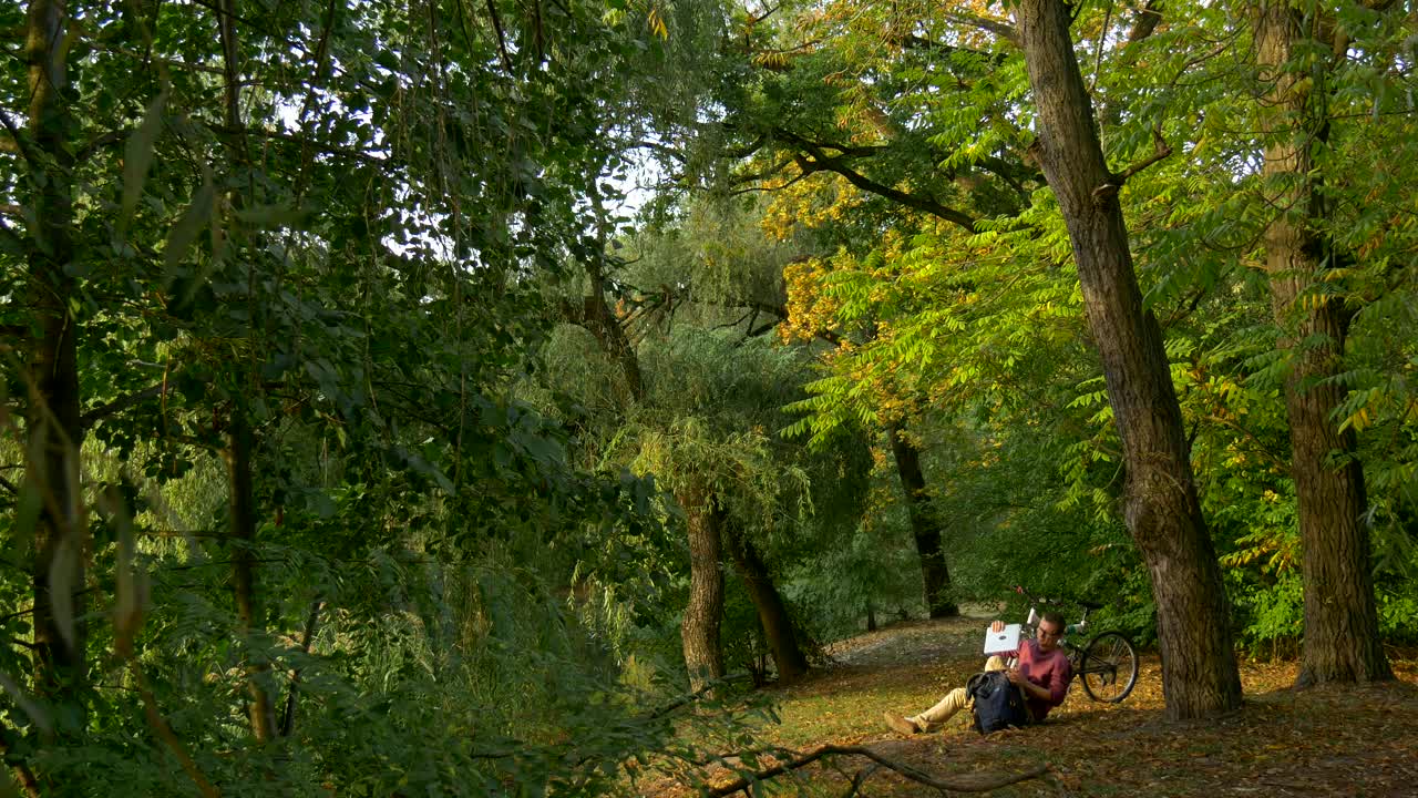 Stock Video A Man Takes Out A Laptop From The Backpack In Live Wallpaper For PC