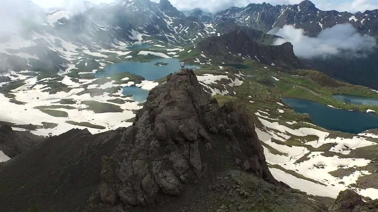 Stock Video A Man Standing On A Mountain Peak Looking At The Live Wallpaper For PC