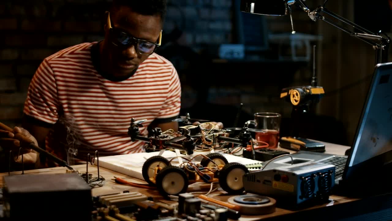 Stock Video A Man Soldiering Circuits In A Drone Live Wallpaper For PC