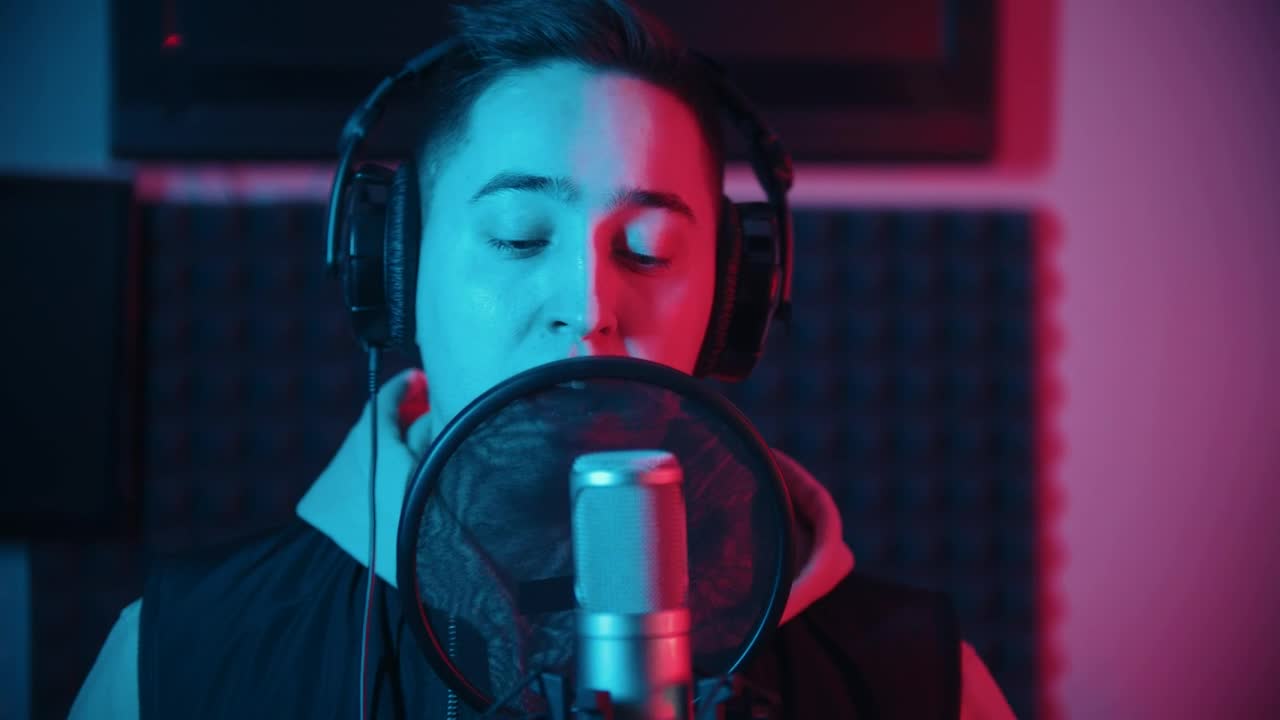 Stock Video A Man Singing To A Professional Microphone Live Wallpaper For PC
