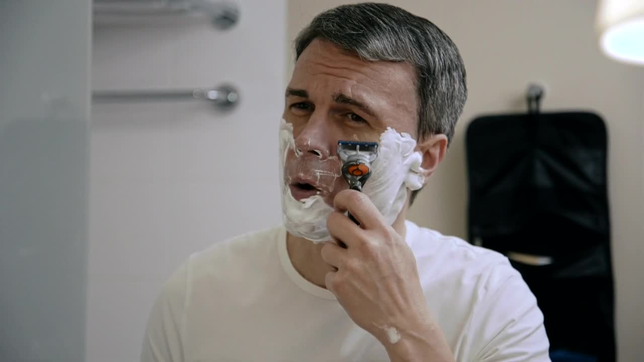 Stock Video A Man Shaving In The Bathroom Live Wallpaper For PC