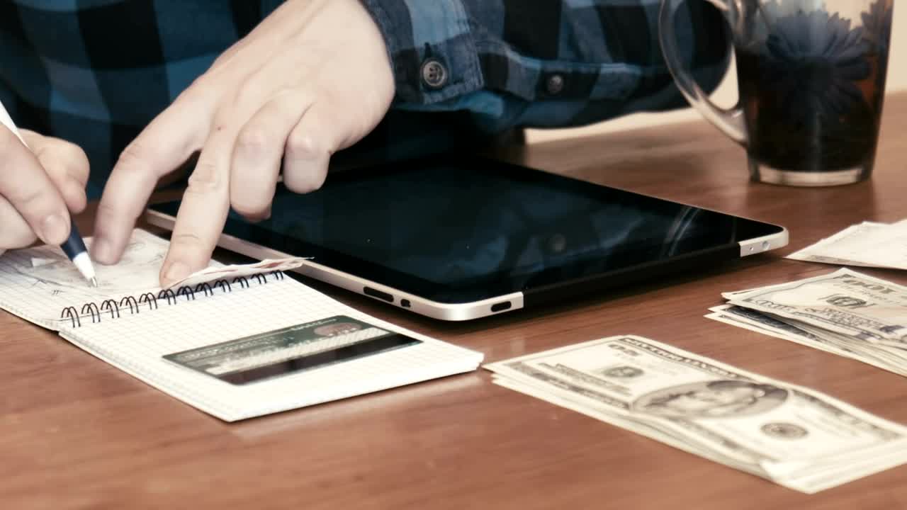 Stock Video A Man Separating Money Into Budgets Live Wallpaper For PC