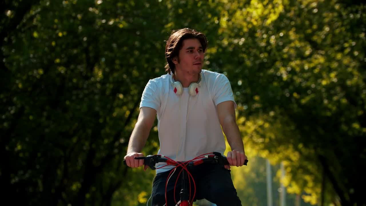 Stock Video A Man Riding A Bike Stops To Look At His Live Wallpaper For PC