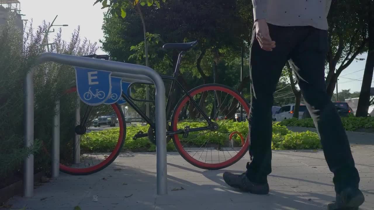 Stock Video A Man Parking His Bicycle In The Street Live Wallpaper For PC