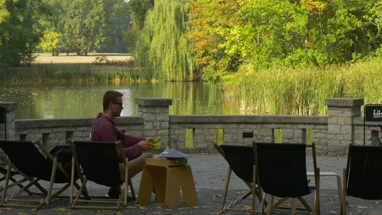 Stock Video A Man Leaves The Terrace By The Lake Live Wallpaper For PC