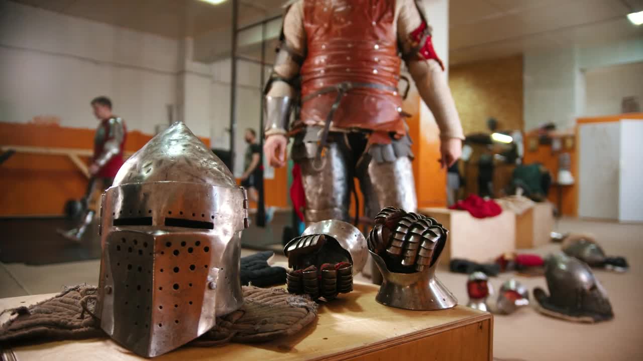Stock Video A Man In The Dressing Room Putting On The Armor Live Wallpaper For PC