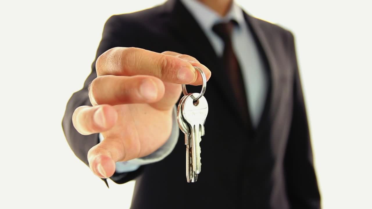 Stock Video A Man In Suit Handing Keys To The Lens Live Wallpaper For PC