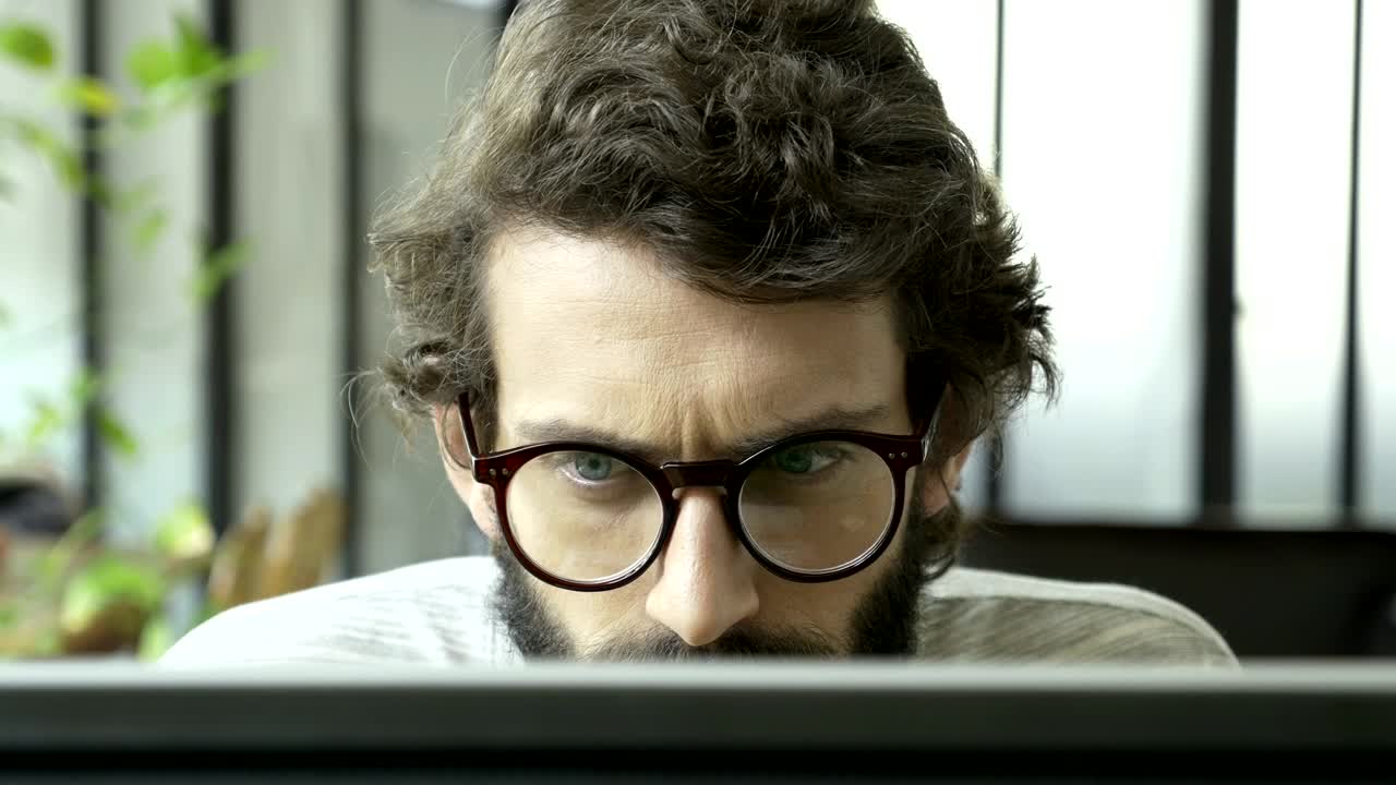 Stock Video A Man Focused On Reading Live Wallpaper For PC