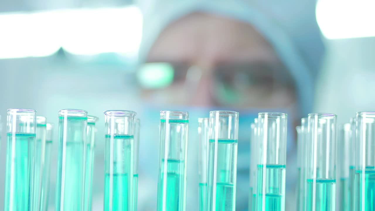 Stock Video A Man Droping Liquid On Lab Tubes Live Wallpaper For PC