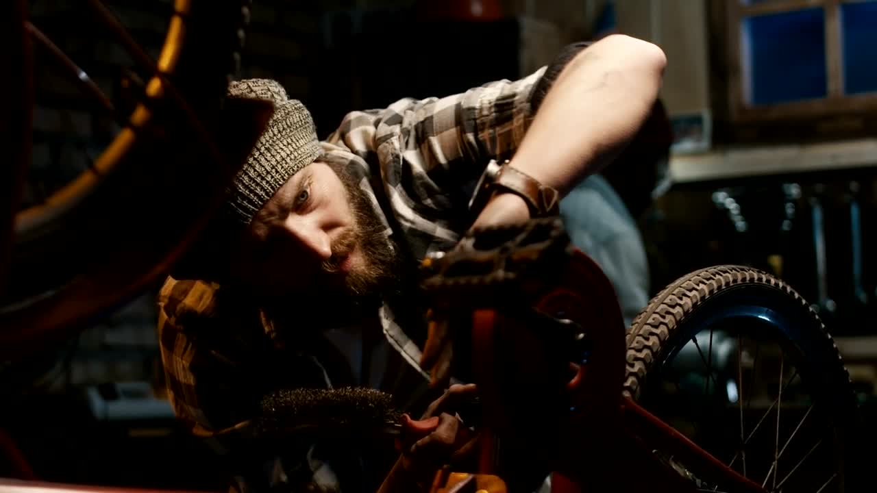 Stock Video A Man Doing Maintenance To A Bicycle Live Wallpaper For PC