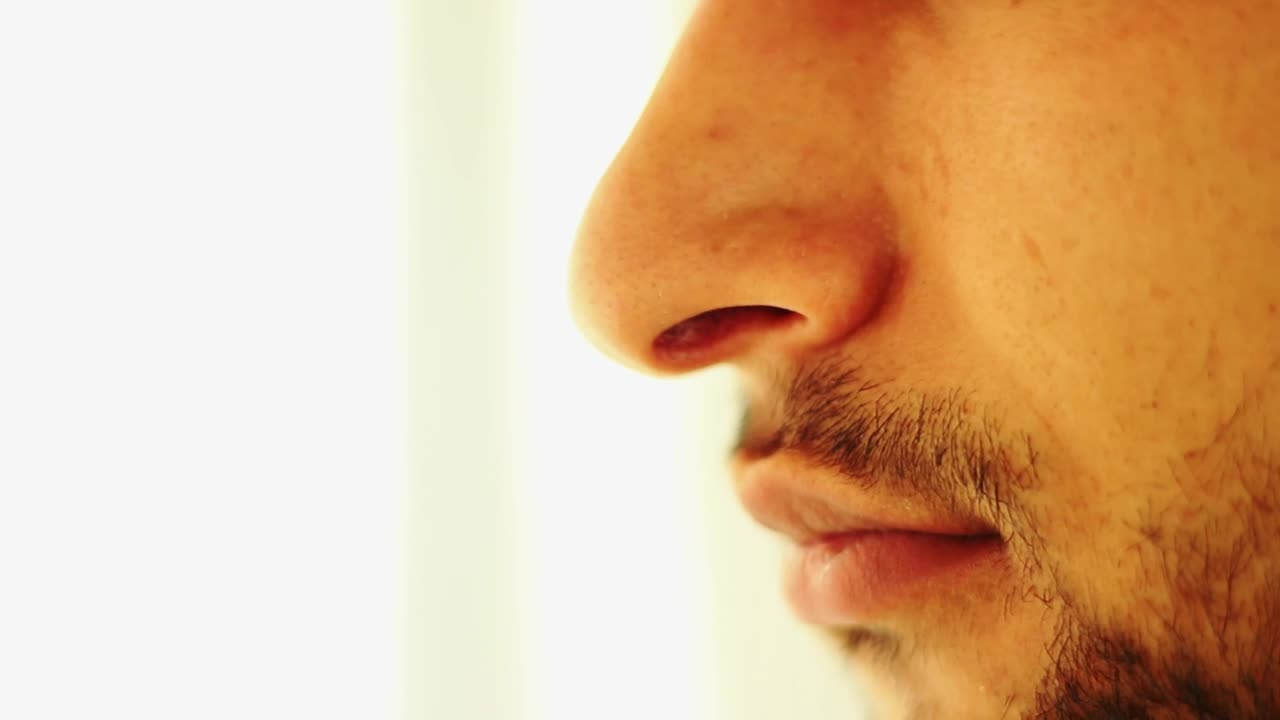 Stock Video A Man Cleaning His Nose With Paper Live Wallpaper For PC