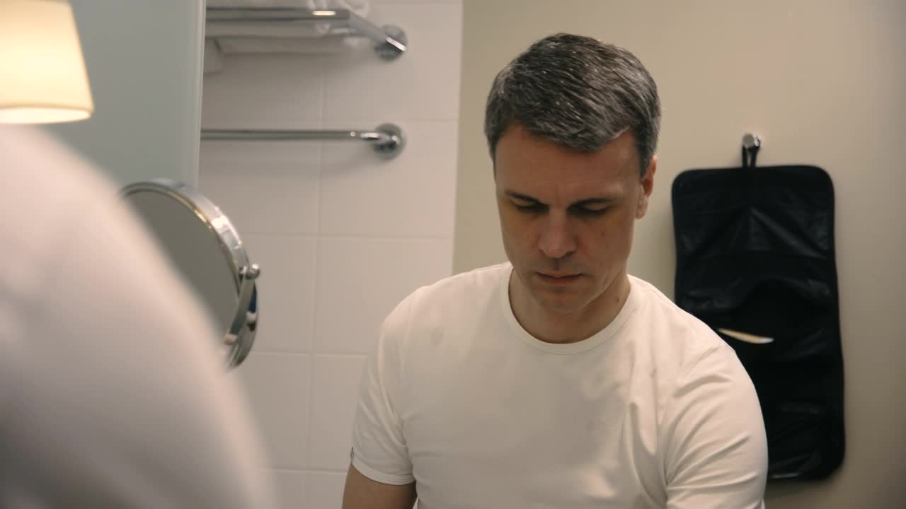 Stock Video A Man Brushes His Teeth In The Bathroom Live Wallpaper For PC
