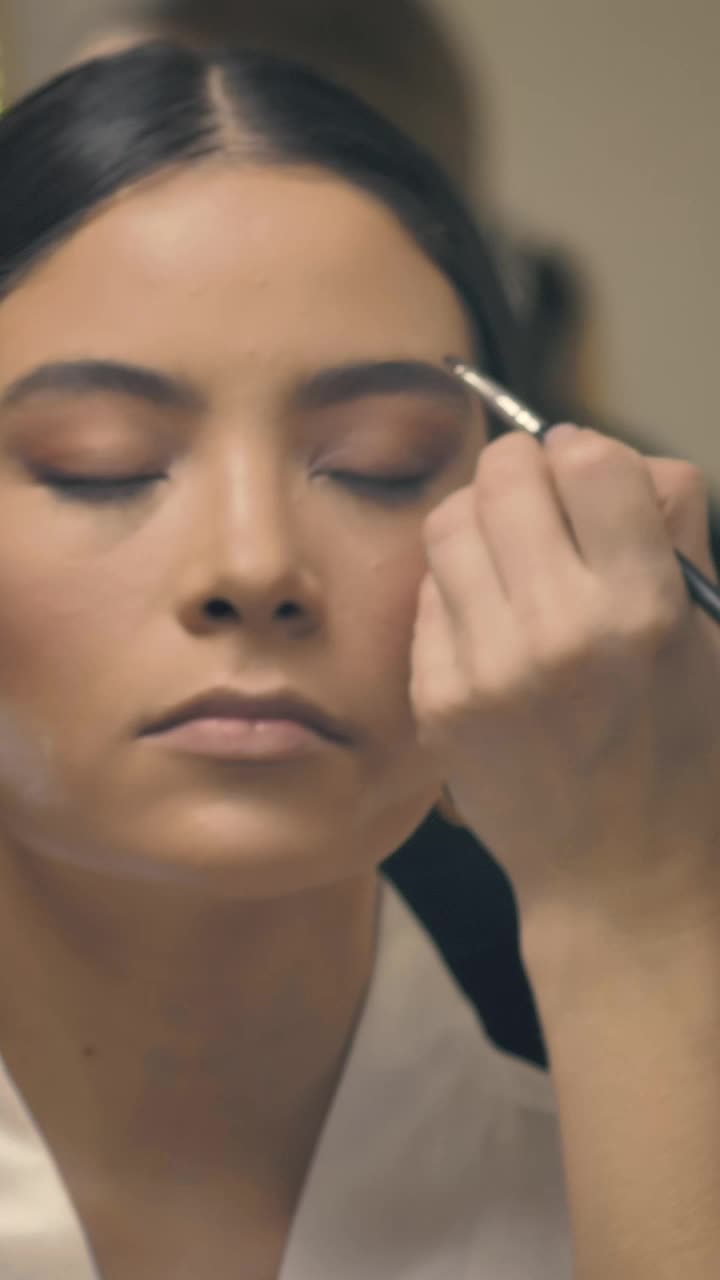 Stock Video A Makeup Artist With Face Mask Putting On Makeup Live Wallpaper For PC