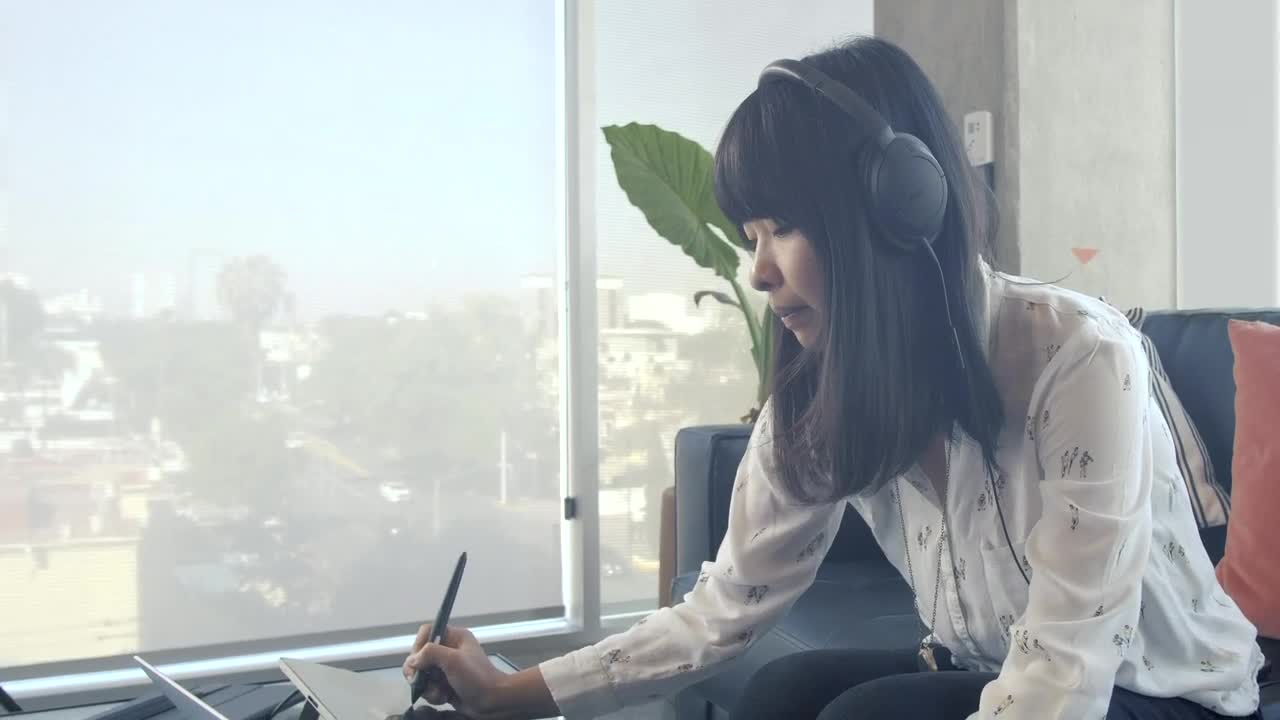 Stock Video A Graphic Designer Working On A Tablet Live Wallpaper For PC