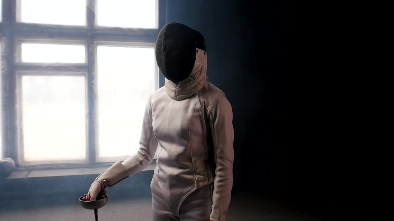 Stock Video A Fencer Putting The Sword Behind The Shoulders Live Wallpaper For PC