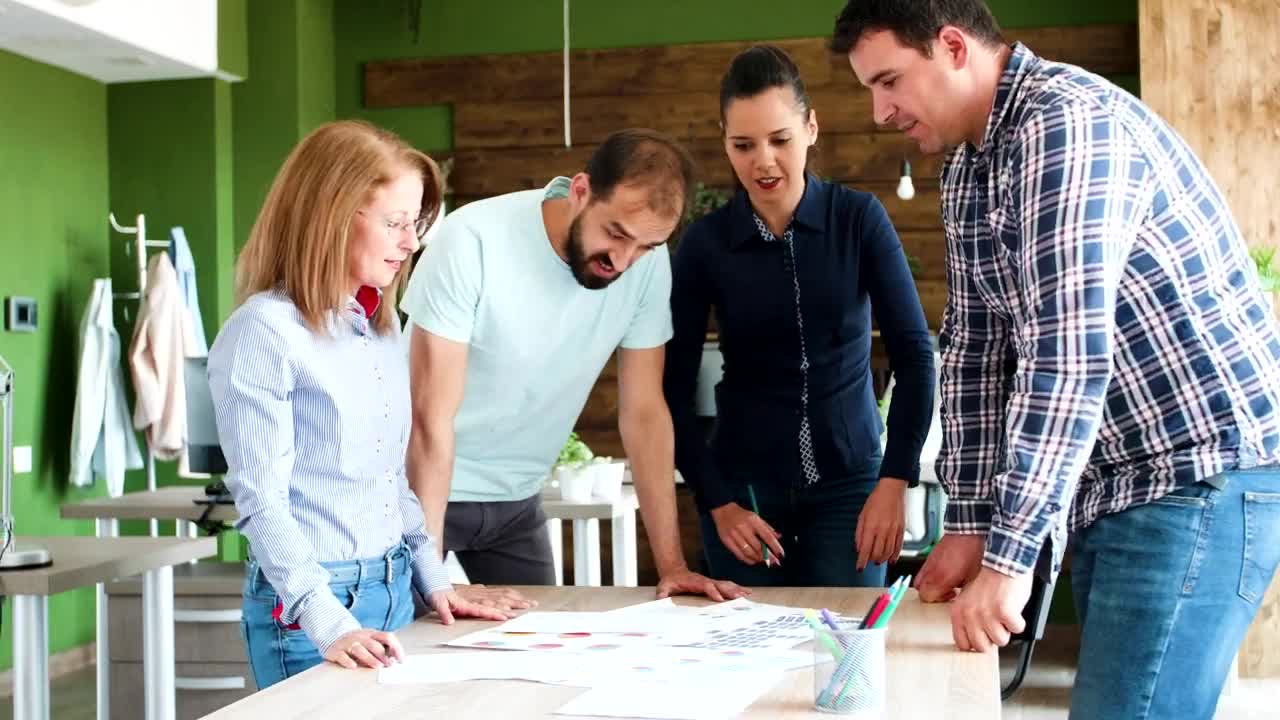 Stock Video Business Team Exchange Ideas Over Table In Green Office Live Wallpaper For PC