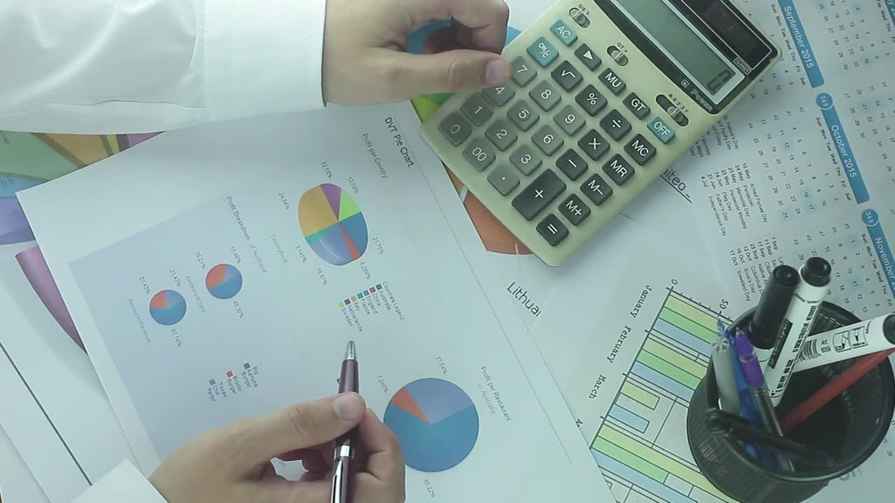 Stock Video Business Man With Calculator And Charts Live Wallpaper For PC