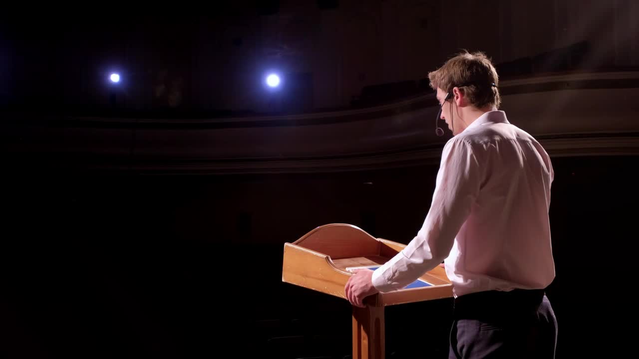 Stock Video Business Conference Speaker At Podium Gestures To Audience Live Wallpaper For PC