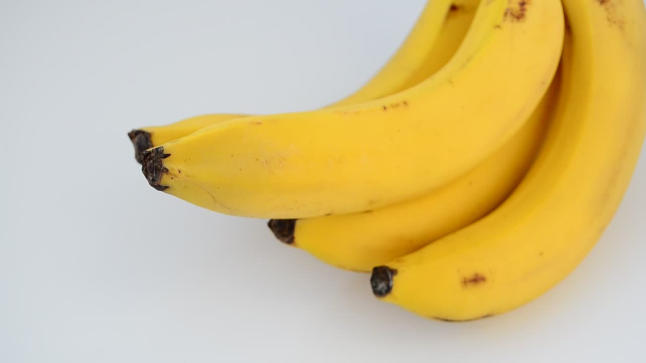 Stock Video Bunch Of Bananas Rotating In A White Space Live Wallpaper For PC
