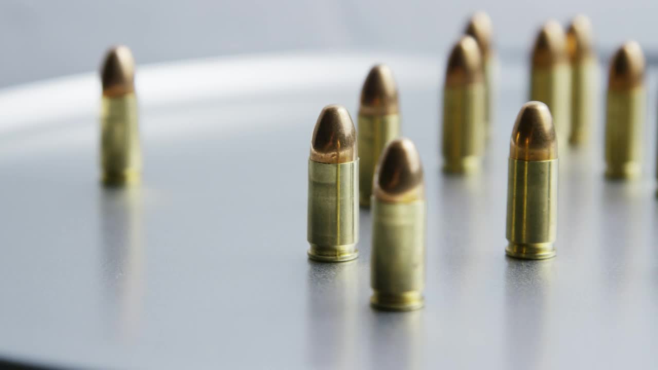 Stock Video Bullets On Metallic Surface Rotating Live Wallpaper For PC