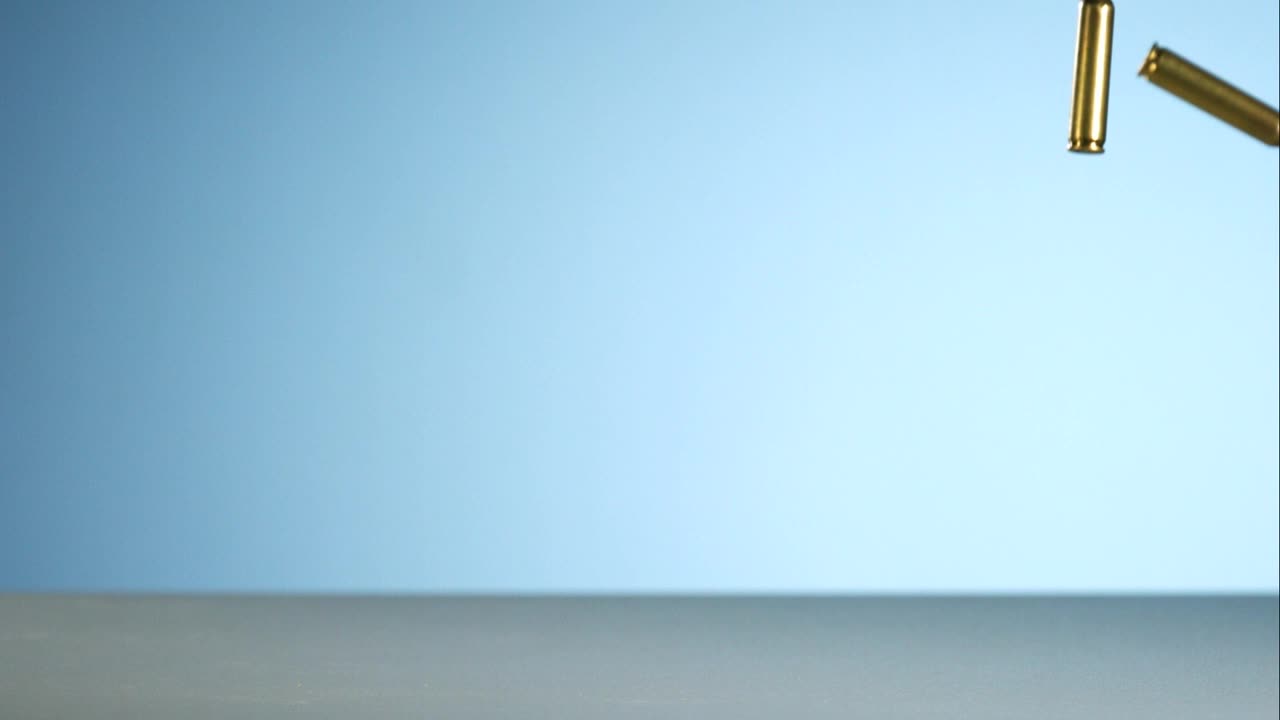 Stock Video Bullets Falling And Bouncing On A Blue Background Live Wallpaper For PC