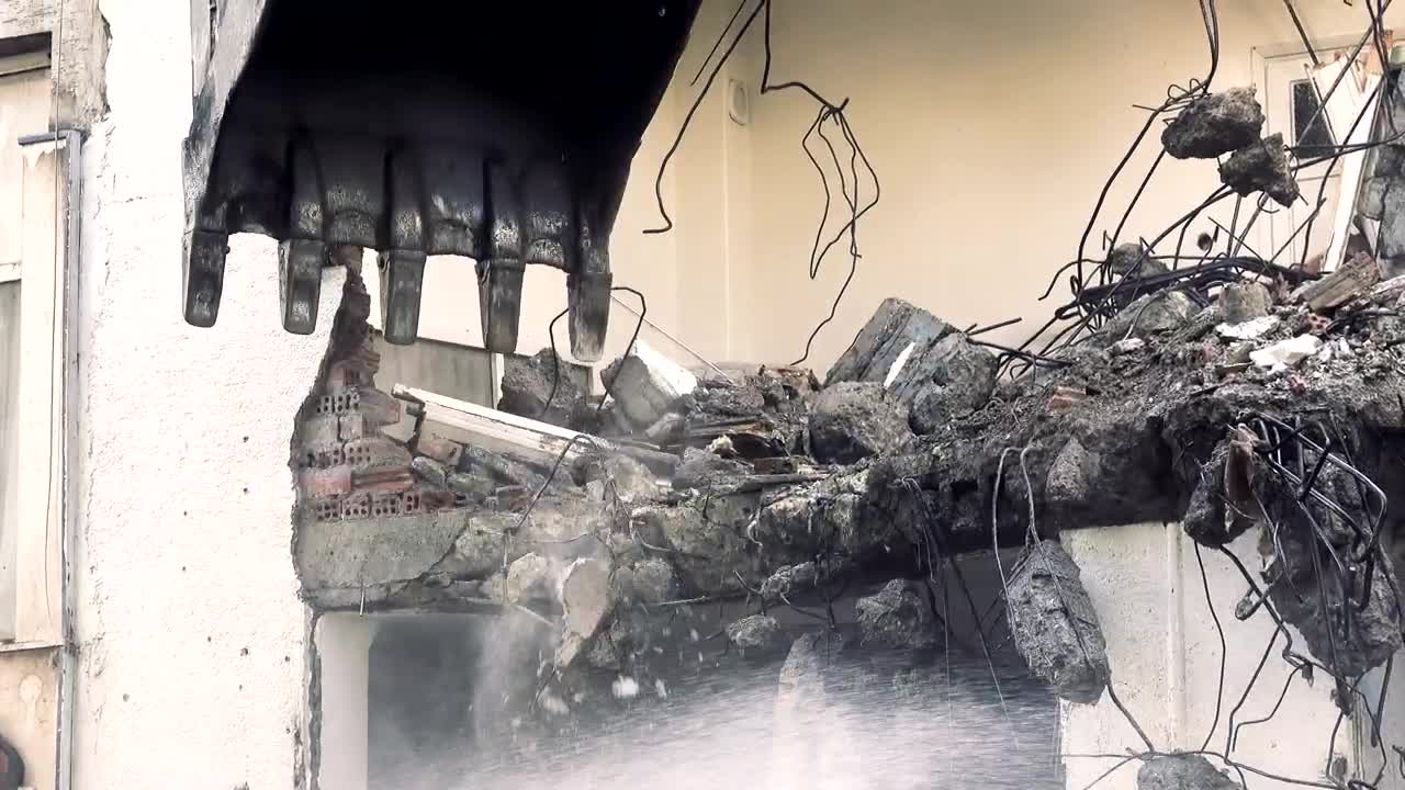 Stock Video Bulldozer Knocking Down The Structure Of A Ruined Building Live Wallpaper For PC