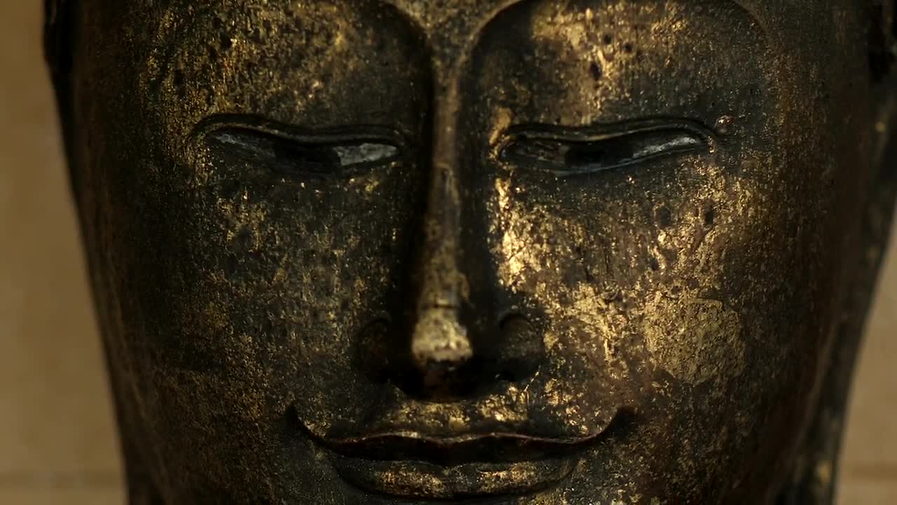 Stock Video Buddha Face From A Metal Statue Live Wallpaper For PC