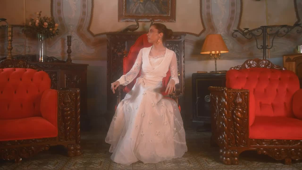 Stock Video Brunette Woman Sitting In A Vintage Chair Live Wallpaper For PC