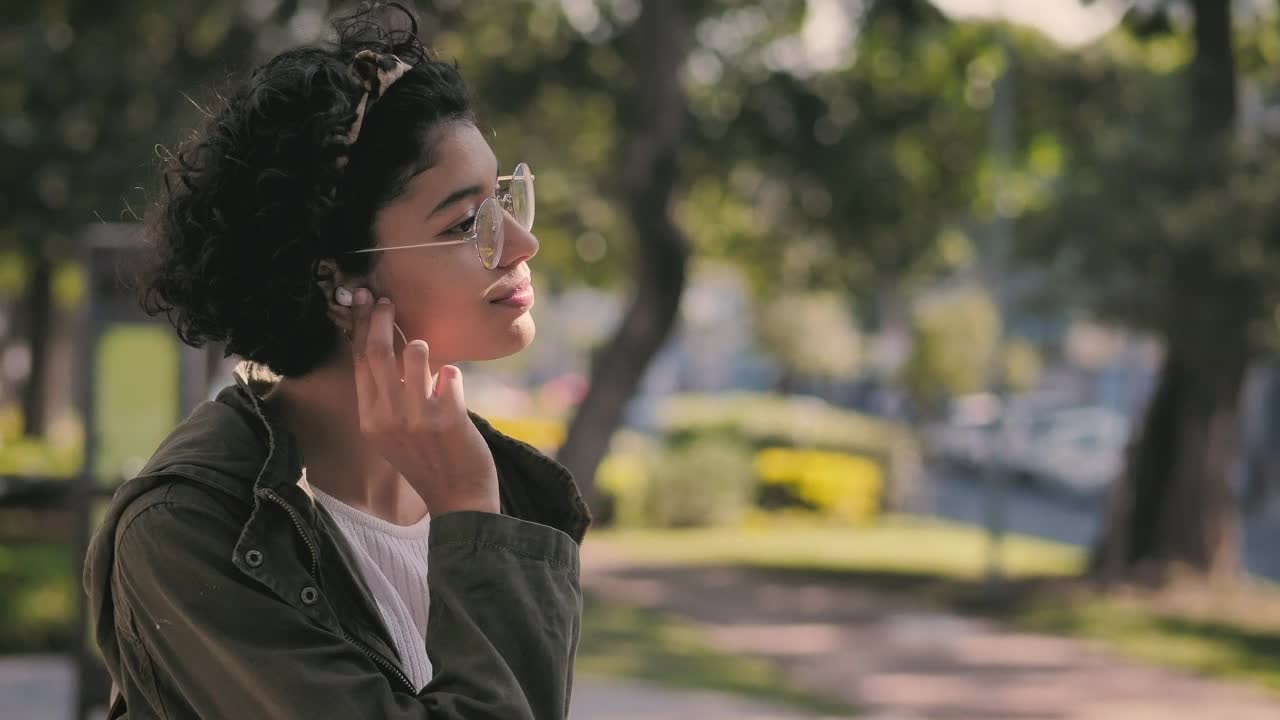 Stock Video Brunette Teen Puts On Her Headphones And Smiles Live Wallpaper For PC