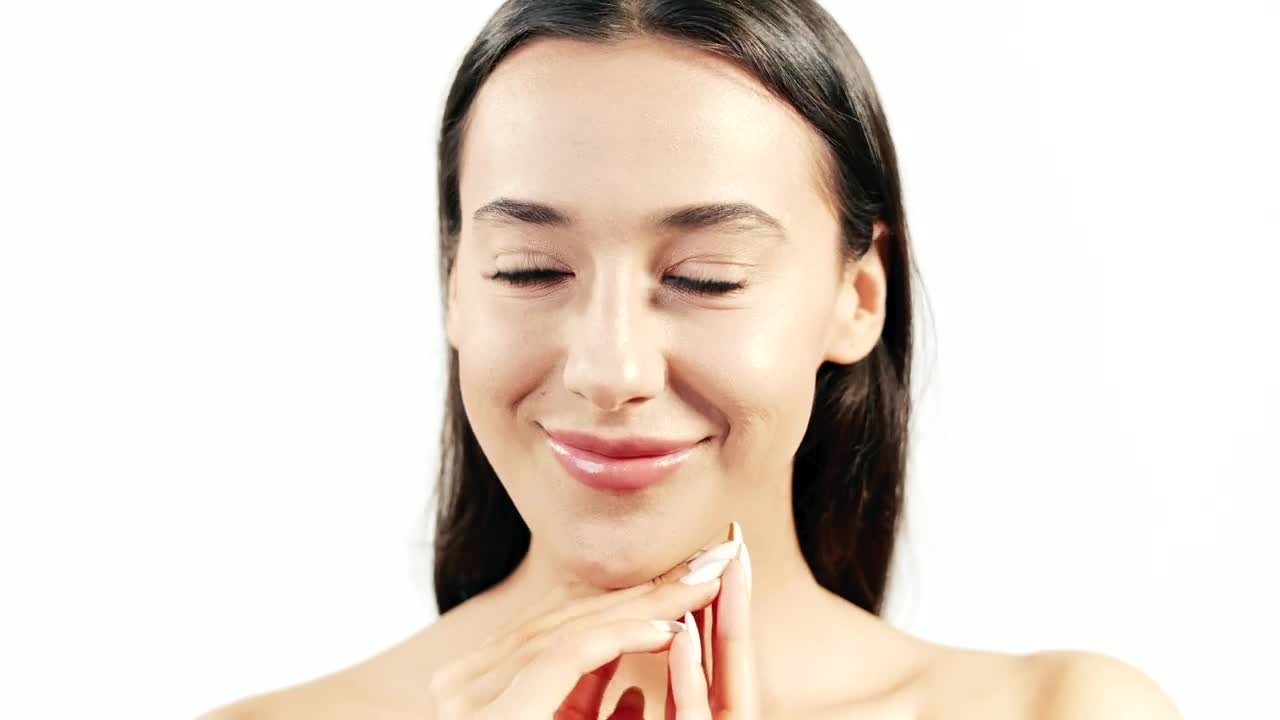 Stock Video Brunette Skincare Model Smiles On White Background Live Wallpaper For PC