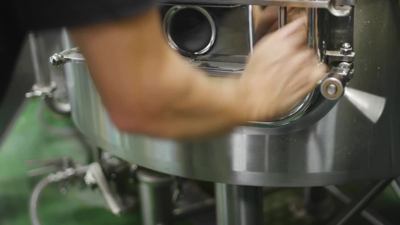 Stock Video Brewer Opening A Barley Bagasse Tank Live Wallpaper For PC