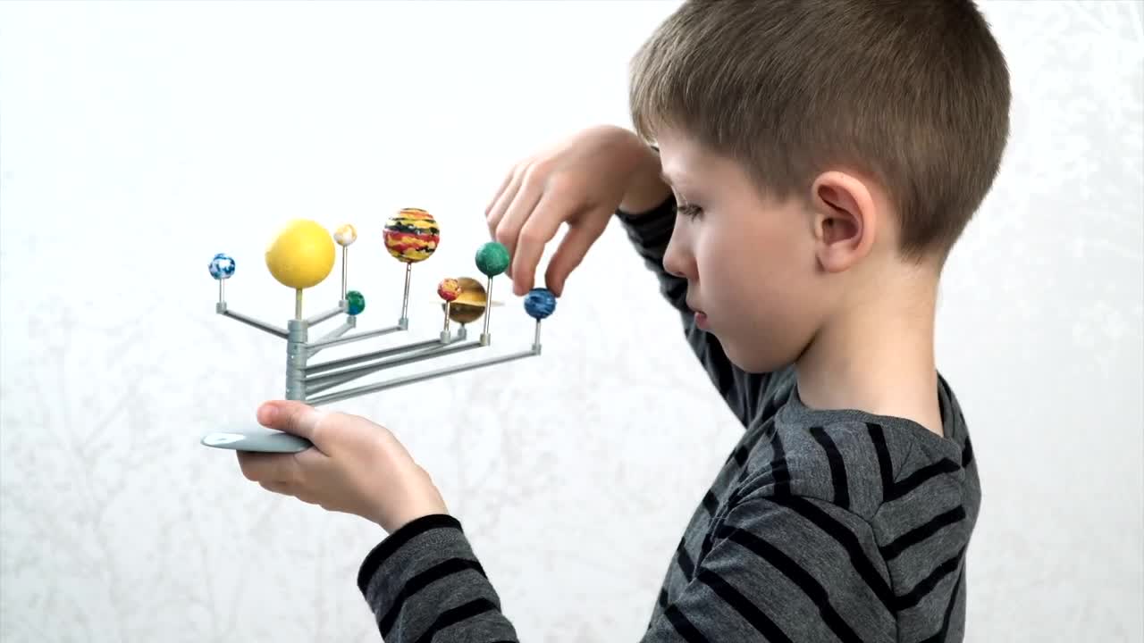 Stock Video Boy With A Model Of The Solar System Live Wallpaper For PC